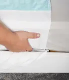 Vignette - Alèse de lit médicalisé réutilisable avec rabats